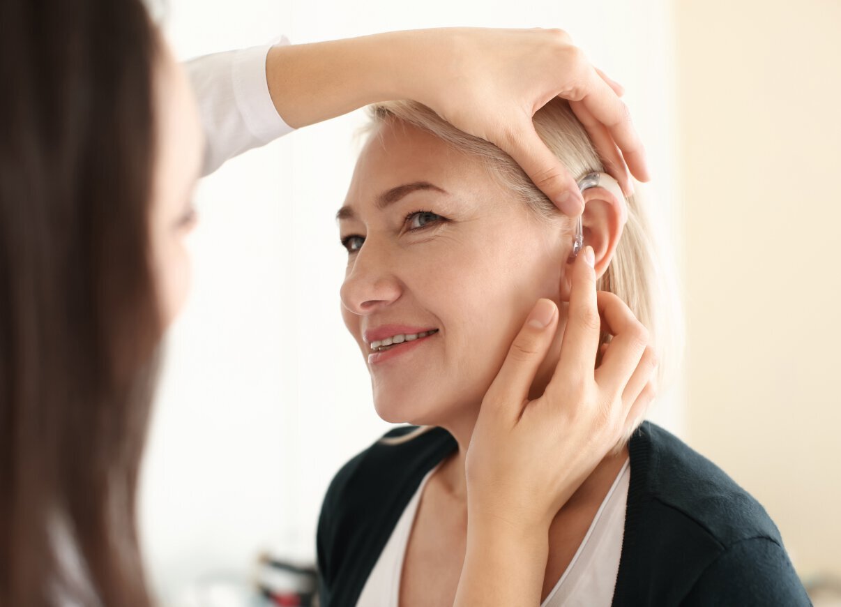 Hearing specialist model with blonde hair